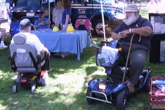 people used wheeled chairs to roll through a festival