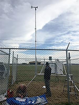 Remote Automatic Weather Station in Tipton County being serviced