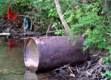 Discarded canister in water