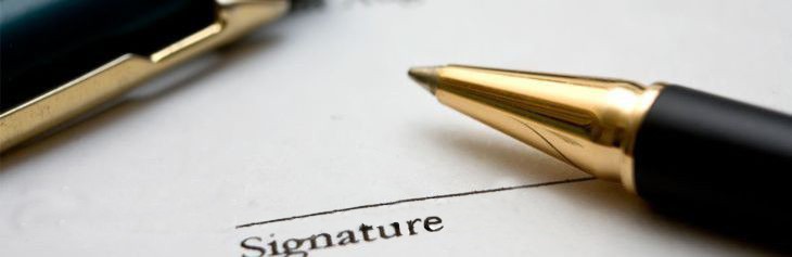 Payments, Licenses & Permits Decorative close-up image of a contract bearing a signature line and a writing instrument laying across it.