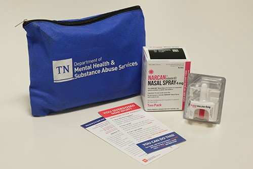 TDMHSAS_naloxone_kit image of blue bag naloxone kit showing narcan nasal spray and printed materials