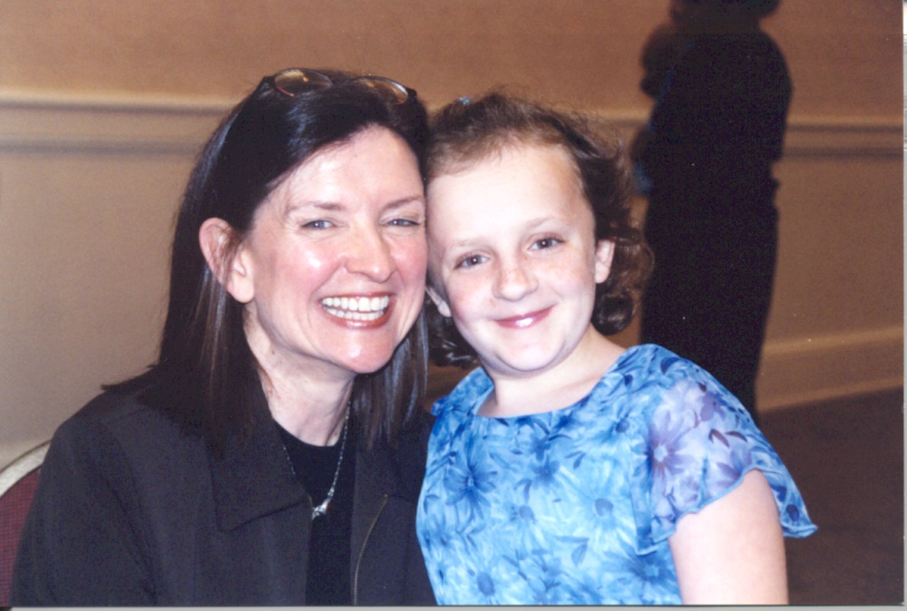 Wanda-Hailey an older photo of Wanda and the daughter of the introduction’s author Lynette Porter. Wanda is shown hugging Hailey, who is a young child with osteogenesis imperfecta. Hailey is now in her mid-20s.