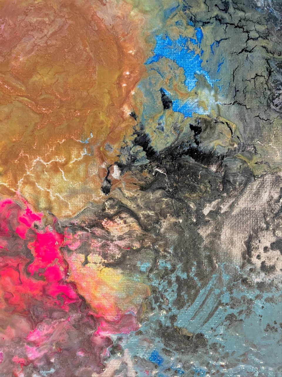 An abstract piece that shows swirls of colors of dark gold, bronze, grays, black, and a few places of bright blue and bright pink