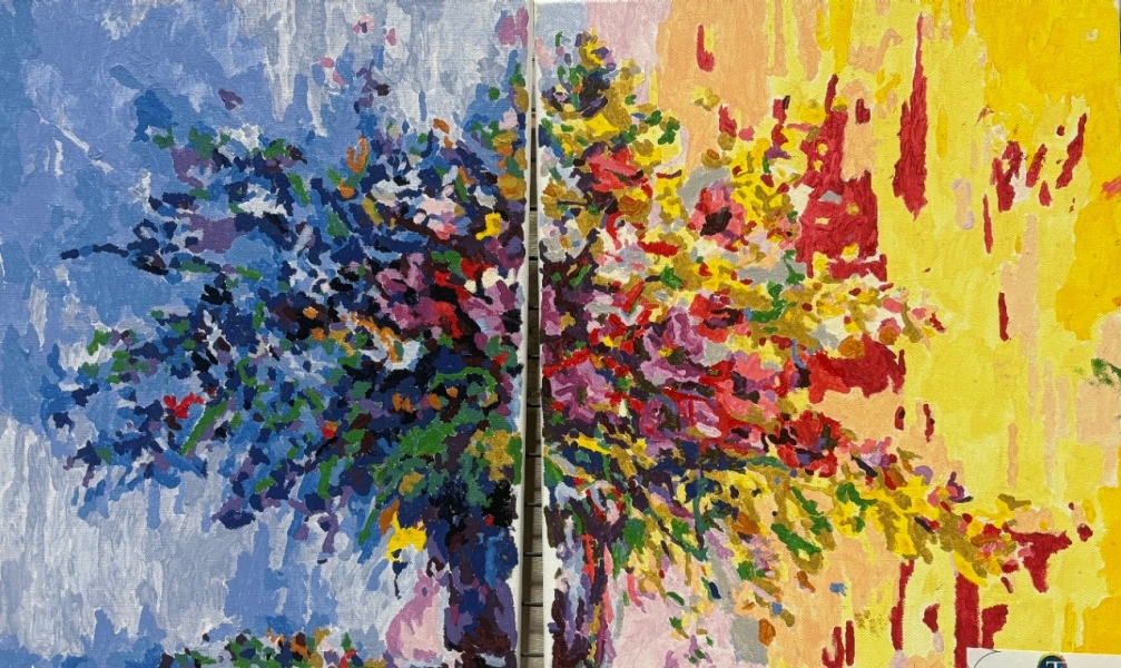 Floral Vase A vibrant diptych painting features an abstract bouquet of flowers divided between two canvases. The left side has a cool-toned background of blues and whites, while the right side contrasts with warm yellows and reds. The flowers, painted with thick, expressive brushstrokes, blend deep blues, purples, reds, greens, and yellows, creating a dynamic and energetic composition. The split between the two panels enhances the contrast, making the piece feel like a meeting of opposing elements—cool and warm, calm and intense.