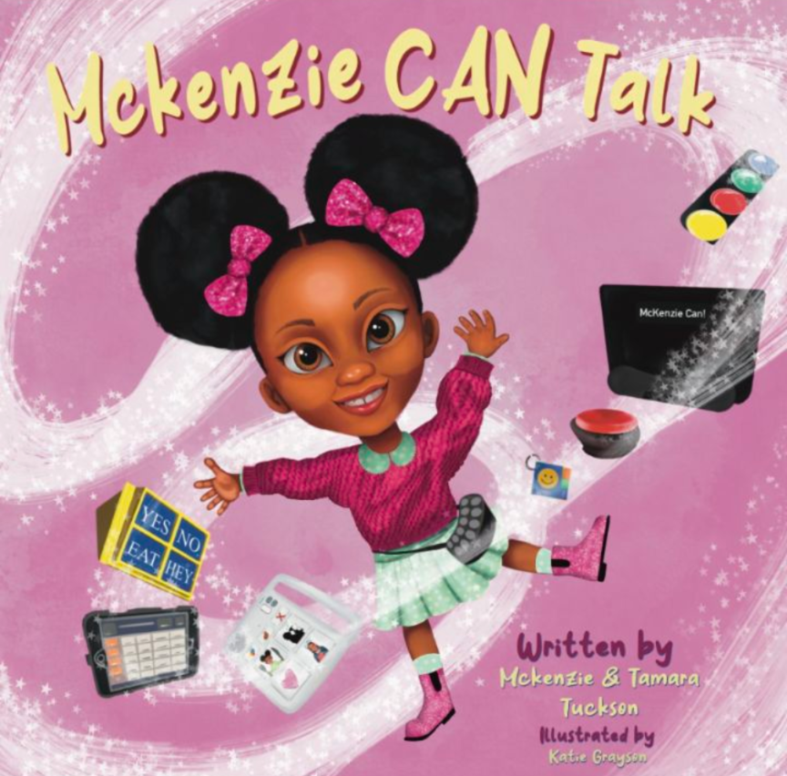 The cover of a children's book titled McKenzie CAN Talk, written by McKenzie & Tamara Tuckson and illustrated by Katie Grayson. It features McKenzie smiling joyfully against a sparkly pink background. She wears a pink sweater, a green skirt, pink boots, and has her hair styled in afro pigtails with pink bows. Around her are various communication tools, including an AAC (augmentative and alternative communication) device, symbol cards, a switch button, and a small board with "YES," "NO," "EAT," and "HEY."
