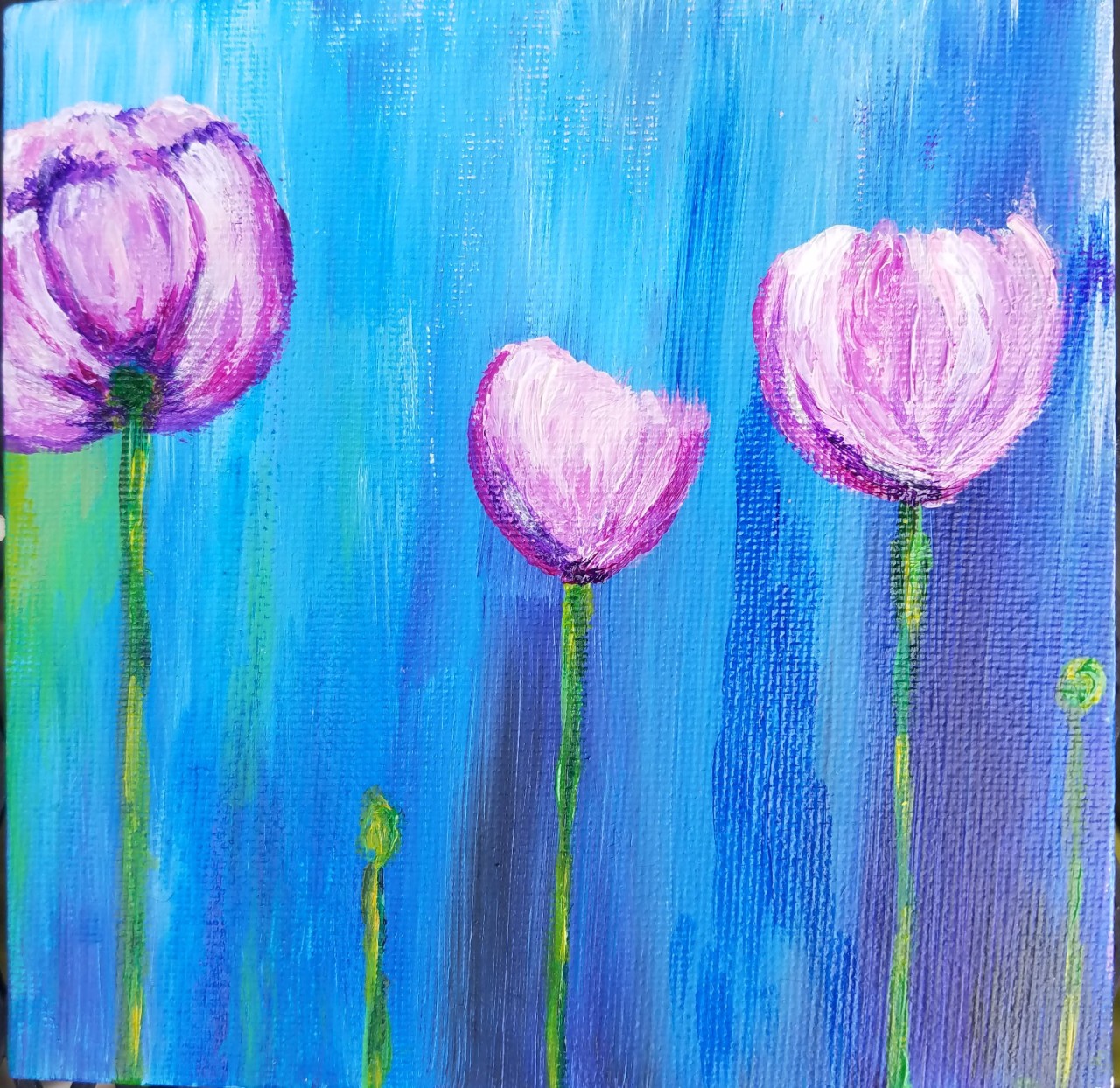 three purple tulips on the end of three long, thin, green stems, and three stems that have not released their buds yet. The background is painted blue. 