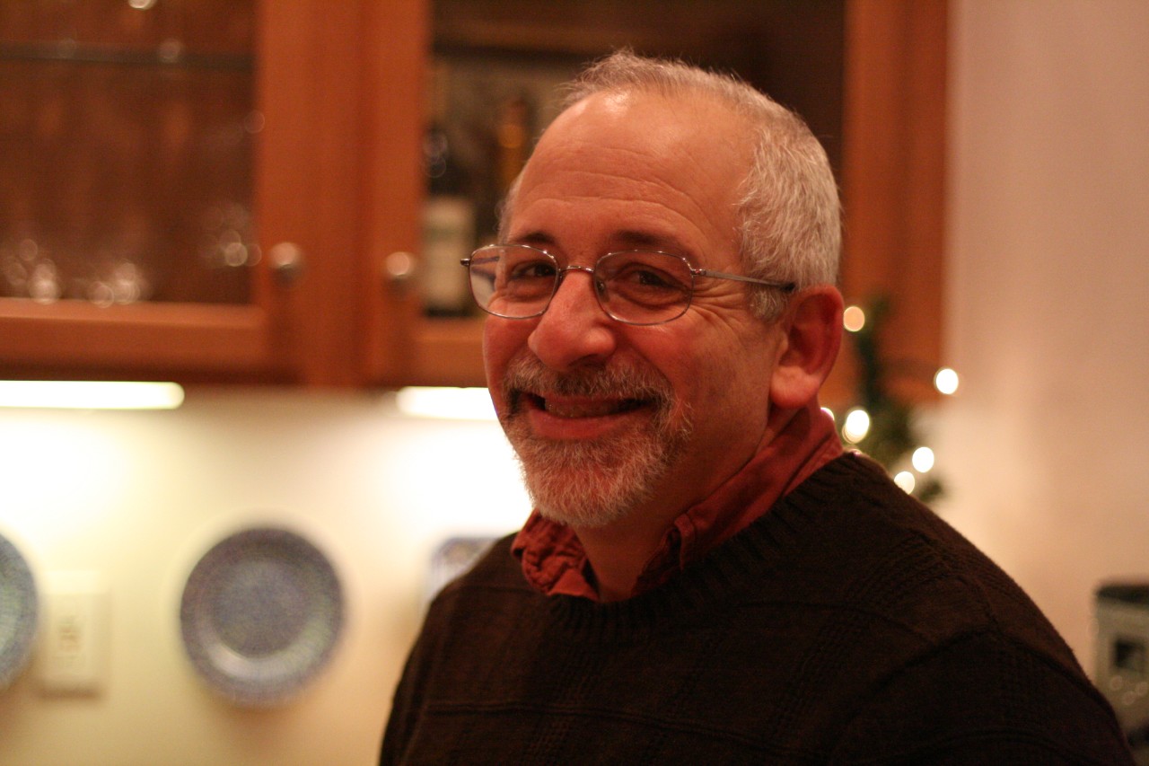 Holiday 2009-3 a warm smiling head shot of Ned at a Council holiday party a few years ago