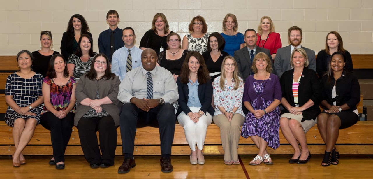 LAEDS 1st Graduating Class, 2017 picture of the LAEDS graduating class. It is a large, ethnically diverse group of men and women, posing on bleachers.