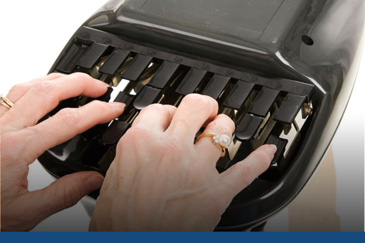 Hands typing on a steno keyboard