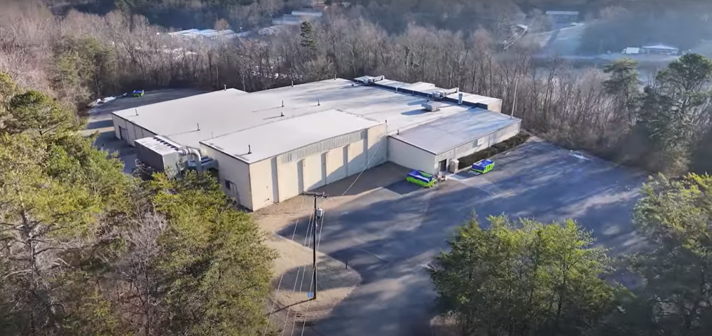 Drone photo of a large industrial warehouse.