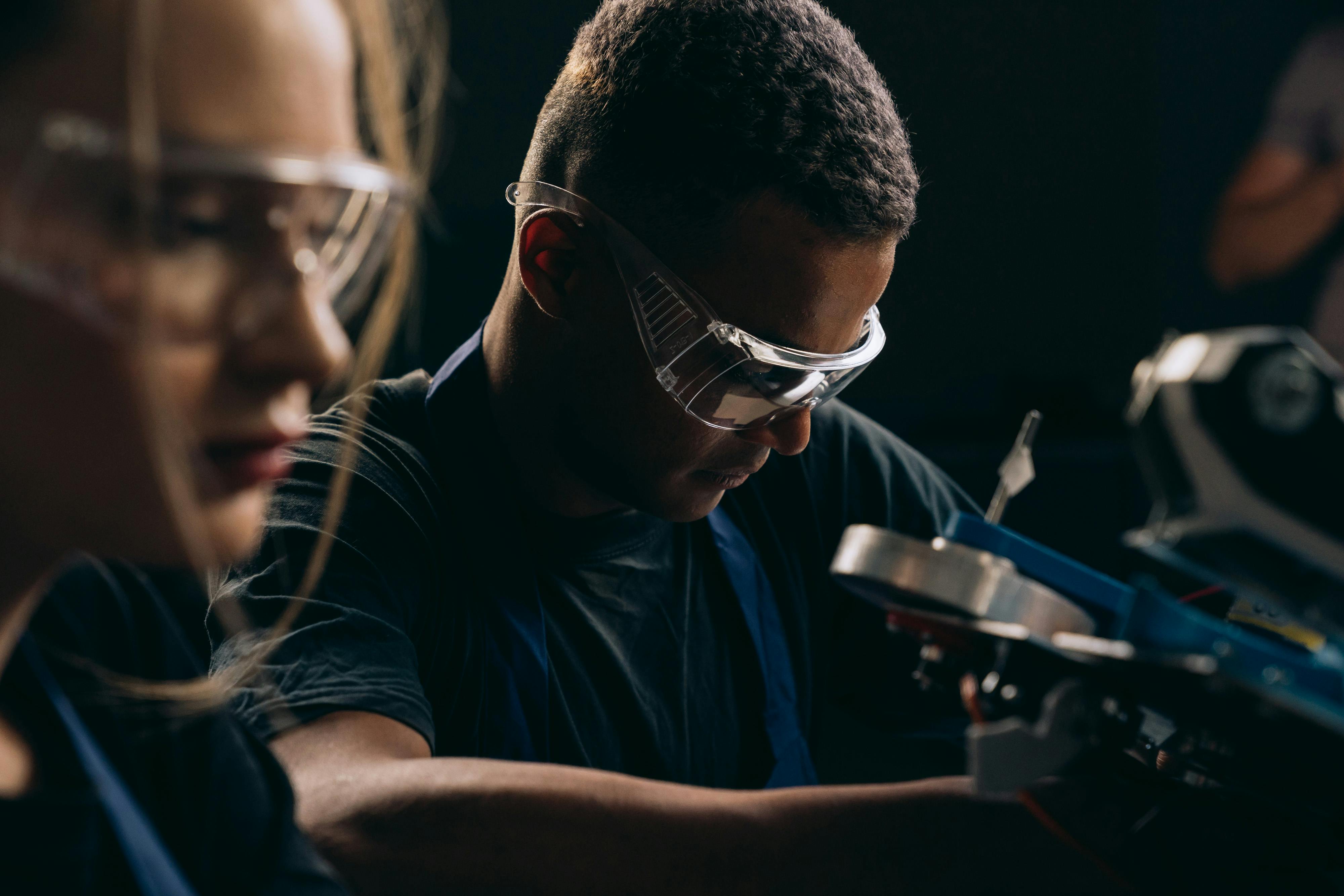 A photo of two workers in manufacturing.