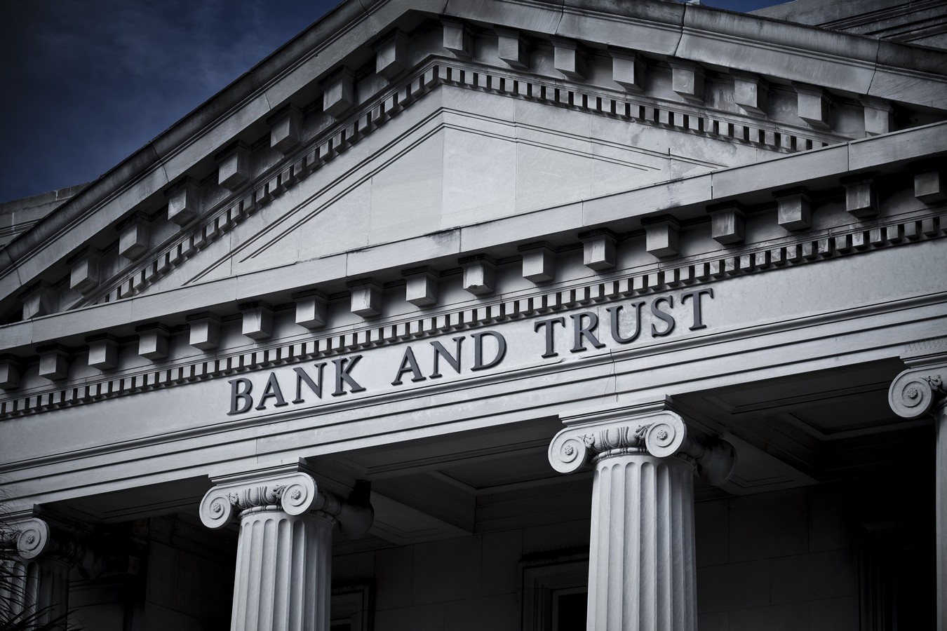 Engraved Bank and Trust faced with columns. 