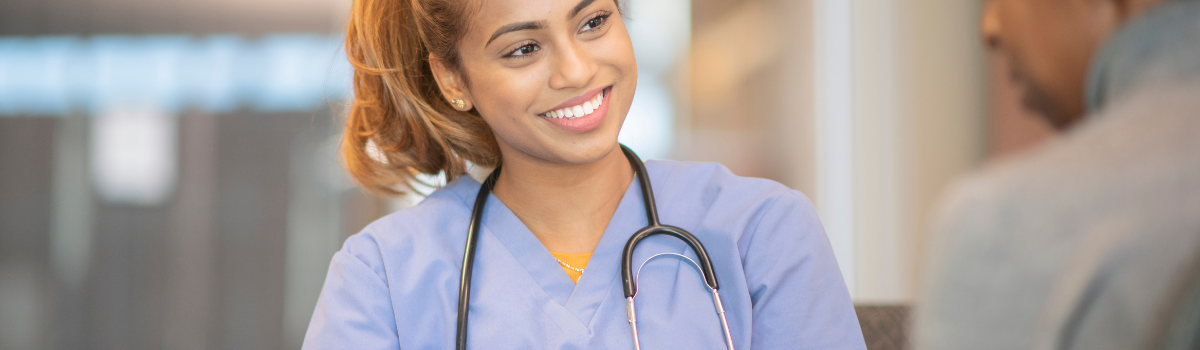 Image of a smiling female nurse.