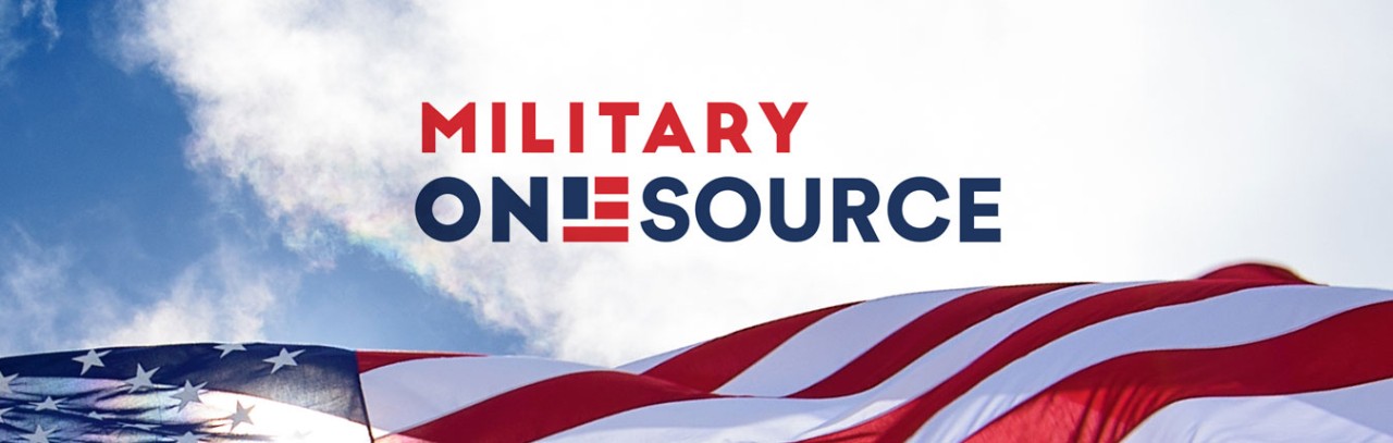 Military OneSource logo - red white and blue text with an American Flag as the letter E in the word onesource. The logo sits on a blue sky background with clouds and an American Flag waves at the bottom of the photo.