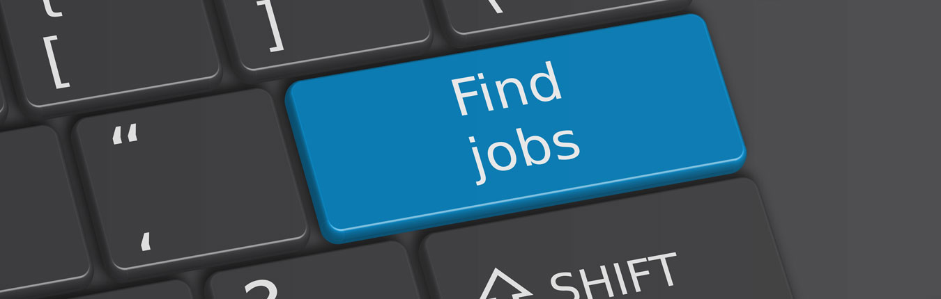 A grey computer keyboard with a blue "Find Jobs" button on it 