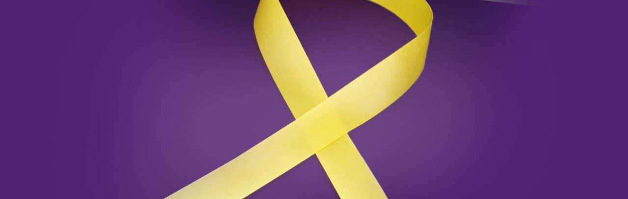 A yellow ribbon is set against a purple background.