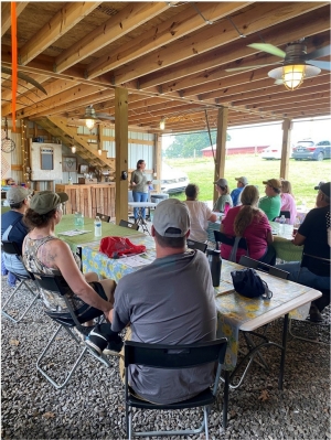 Picture taken during one of the education sessions in East Tennessee, instructor giving class while farmers are attentively paying attention.