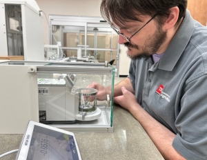 Tennessee Department of Agriculture Metrologist Nick Andersen in the small mass laboratory Tennessee Department of Agriculture Metrologist Nick Andersen in the small mass laboratory