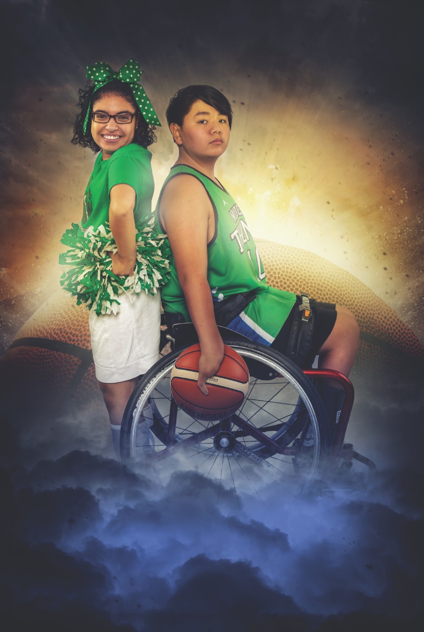 Two Asian teenagers, a sister and a brother, are posed back to back in this poster. The girl is in a cheerleading uniform with a green T-shirt, white skirt, and green-and-white hair ribbons and pom-poms. She has a big smile. Her brother is seated in his wheelchair in a green basketball jersey and athletic shorts. He is holding a basketball and looks determined and serious. The background of their poster is a vague image of a large basketball and they are standing amongst clouds.