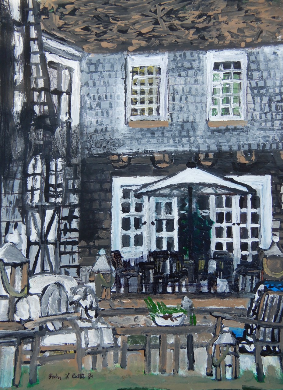 A painting shows the back of a two-story brown and white house with many windows, and an empty, peaceful, shaded patio. The patio has a table with an umbrella and lots of chairs. In the foreground of the painting, there’s comfortable lawn furniture and a potted plant on a table.