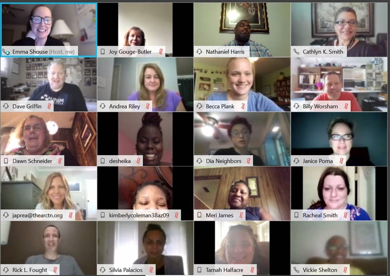 A Zoom meeting screen capture shows a diverse group of faces smiling at the camera. 