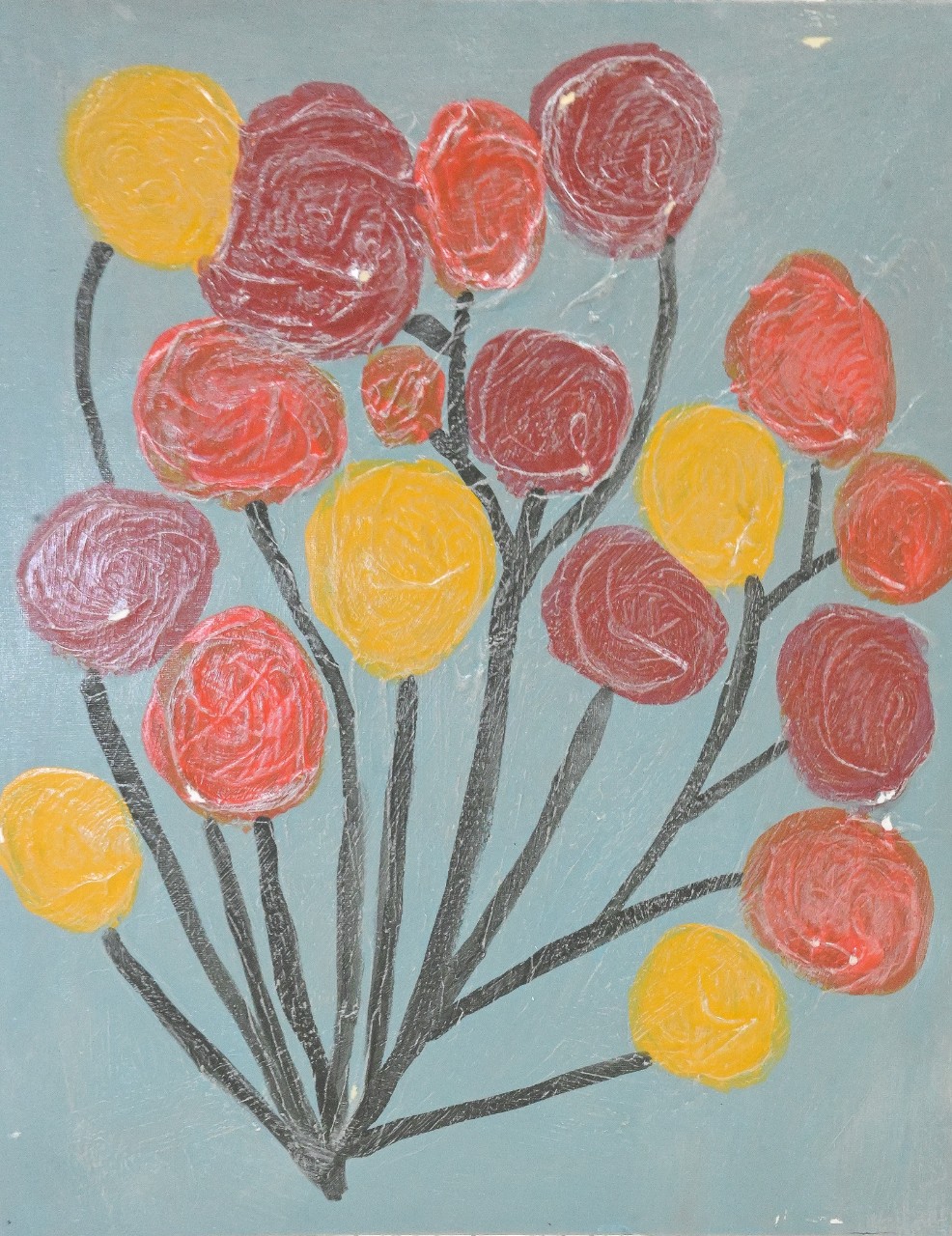 A painting shows a group of round balloon shapes clustered together on thin black stems. The balloons are painted in red, pink, and yellow, with thick, swirling brush marks inside each circle. The background is a soft blue, and the paint has a slightly rough, layered texture.