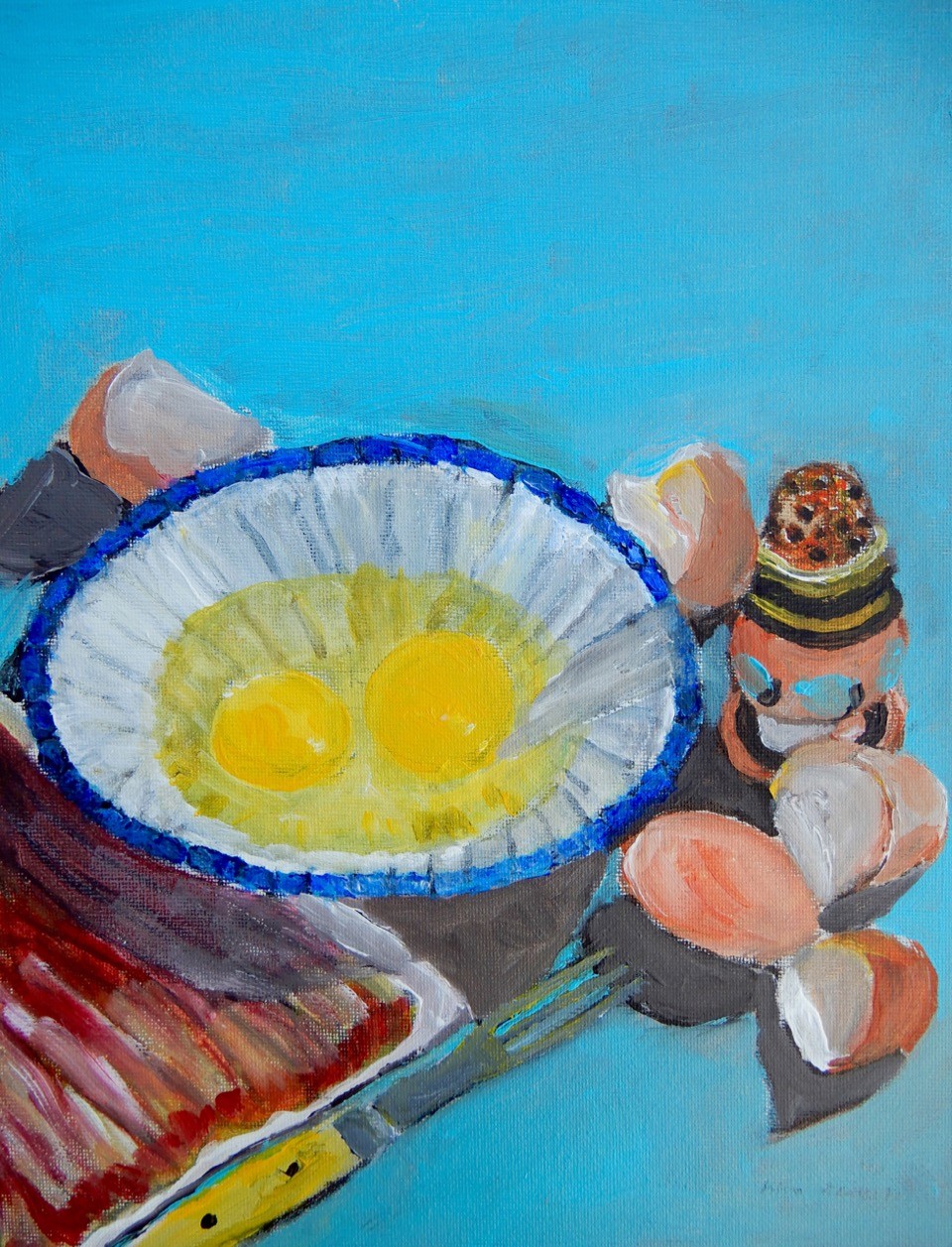 a painting by John Butts, Jr. called “Over Easy”. It is kind of a still-life of a breakfast scene, and features a white and blue bowl with two cracked raw eggs, egg shells outside the bowl, a fork, a saltshaker and a slab of raw bacon. All of these items are set against a light blue background.
