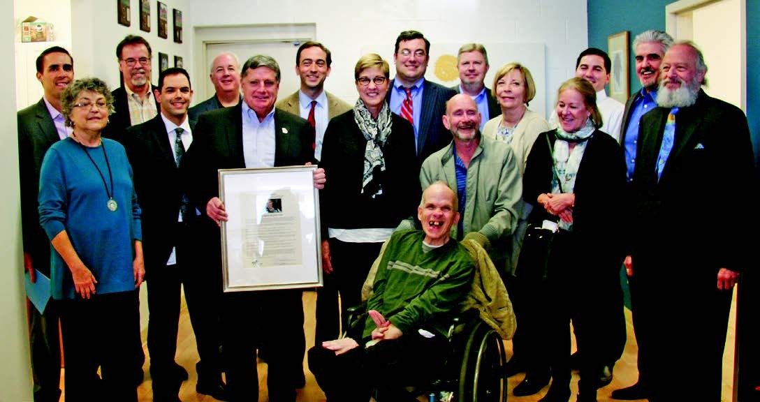 second photo is a large group shot with Martin and many members of the UCP board of directors. The caption reads Martin McGrath with Mr. and Mrs. William Millard Choate and members of the Board of Directors of United Cerebral Palsy of Middle Tennessee