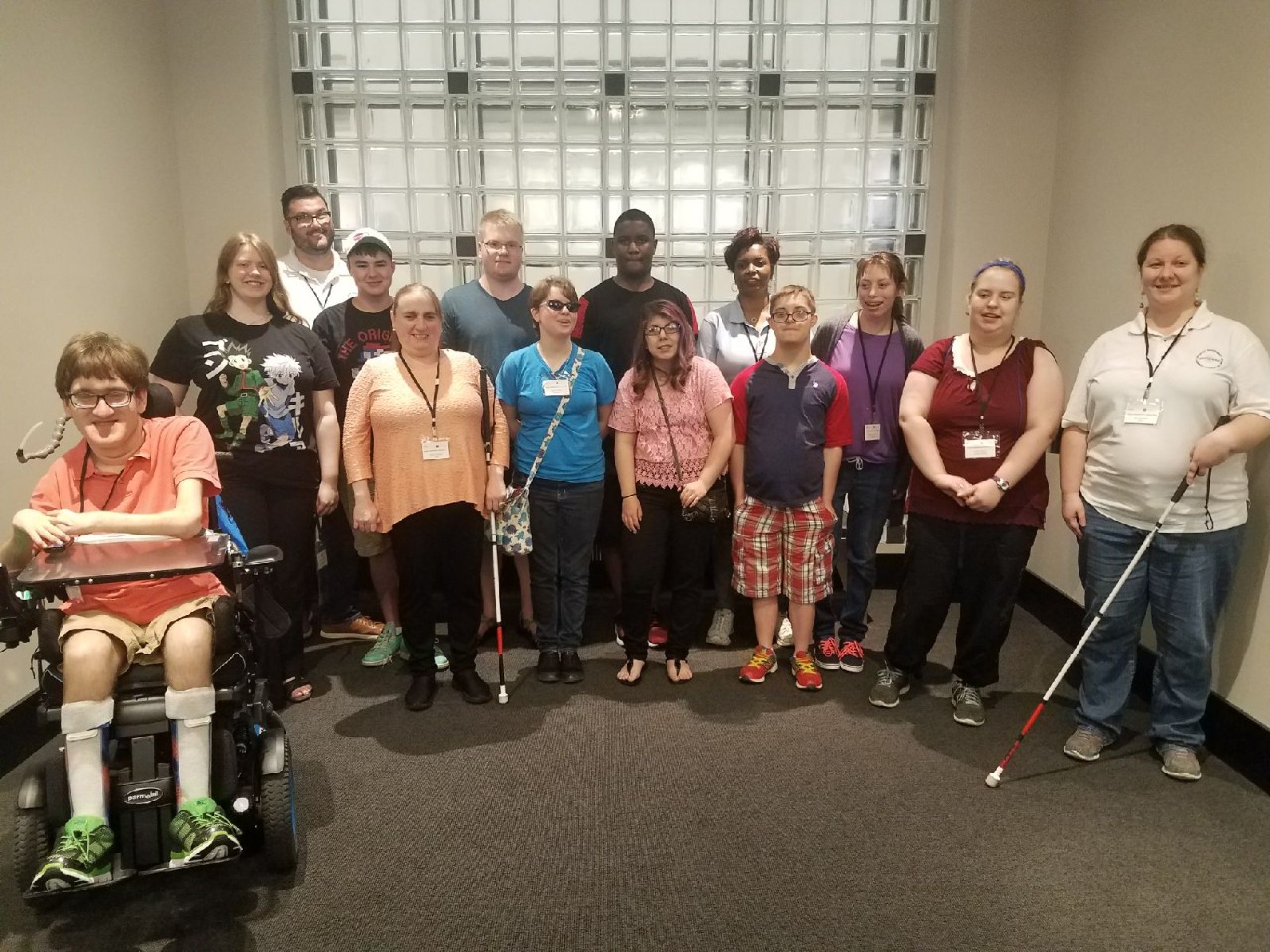 a group photo of about 10 young adults with various types of visible and invisible disabilities, and several adults with and without disabilities who helped lead the youth leadership program that the article will describe