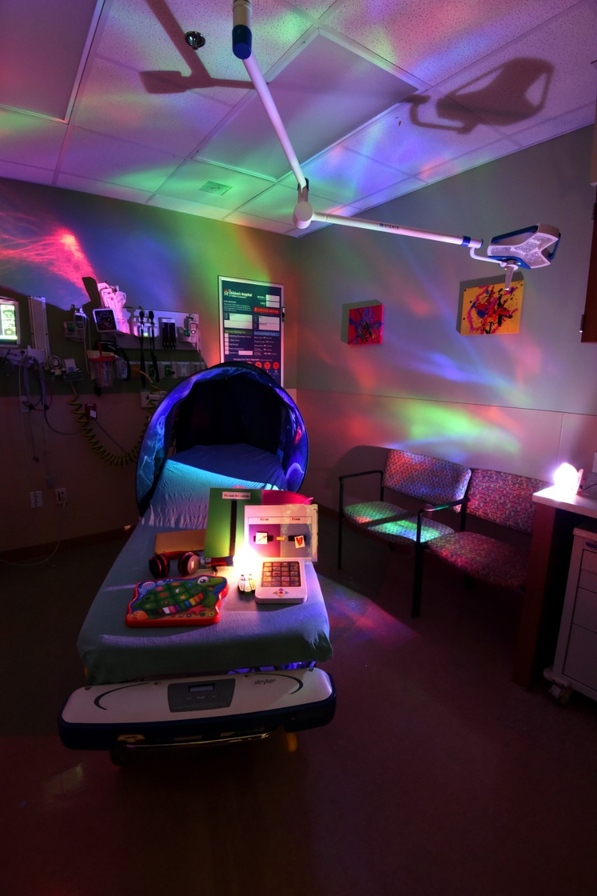 a pediatric emergency room waiting area at Tristar Centennial. The room is equipped with adaptable multi-colored lights and specialized toys for children who may be on the autism spectrum