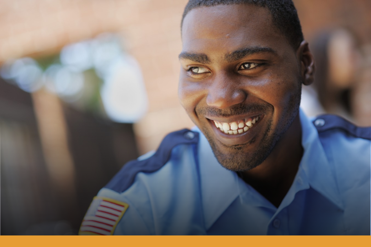 Smiling face of a man wearing a security guard uniform