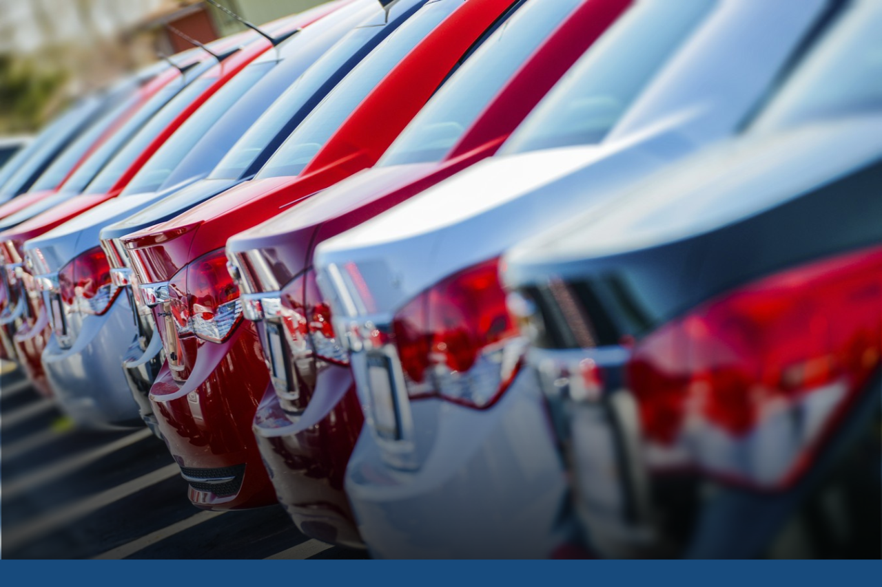 Back of many cars lined up in a row