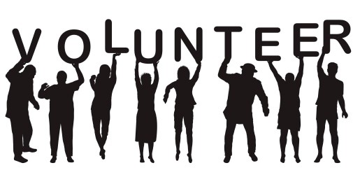 Photo of People Holding Up Letters Spelling Volunteer