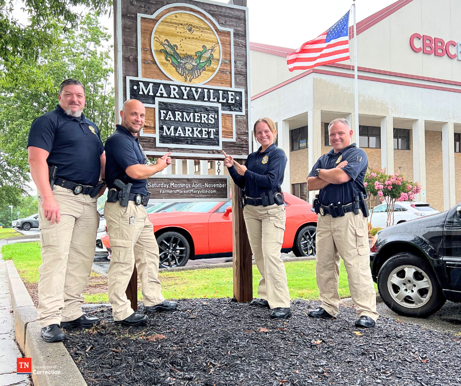 Photo of probation parole officers with Maryville sign