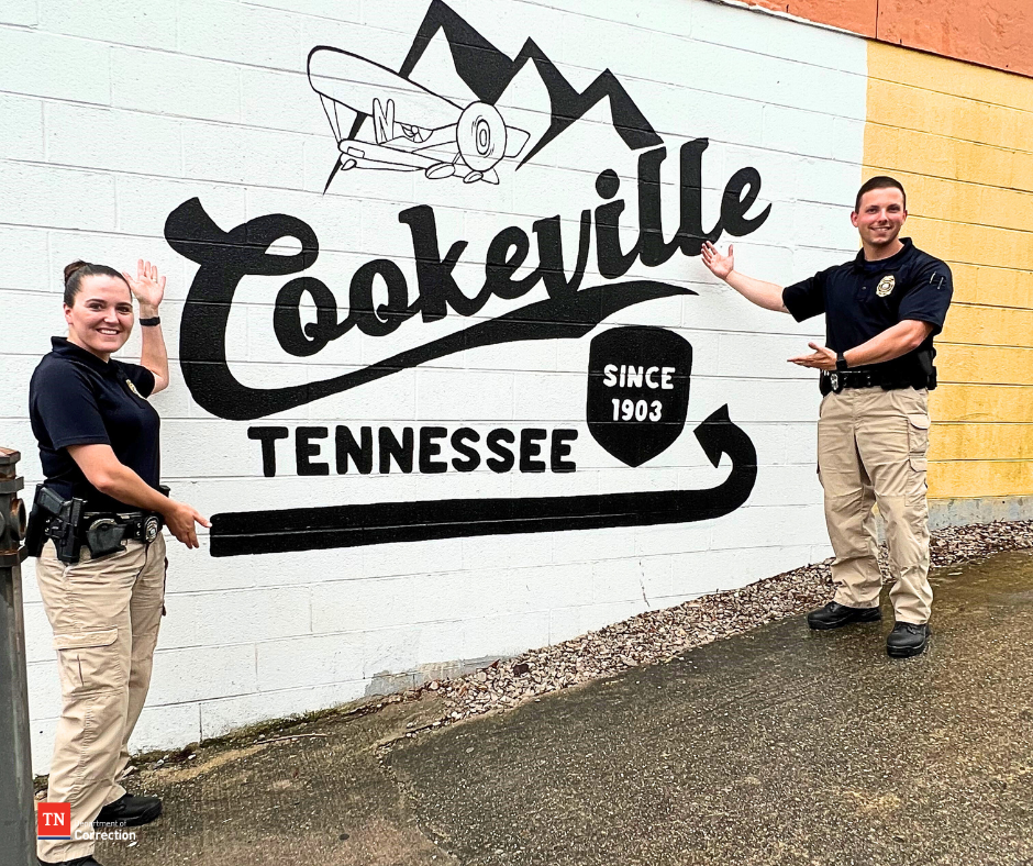 Photo of probation parole officers with Cookeville mural