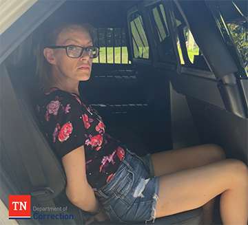 Photo of Rachal Dollard in Backseat of Police Vehicle