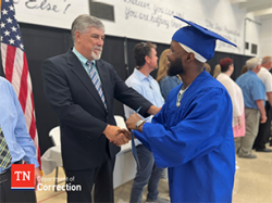 Photo of TCAT Graduate Accepting Certificate