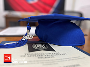 Photo of Graduation Cap and Certificate