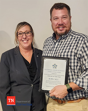 Photo of PPO Rob Call with plaque for Officer of the Year