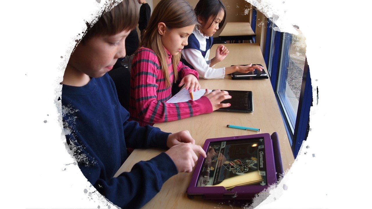 Clickable image of elementary aged kids working at a table that links to the Elementary and Middle School Students Information Page