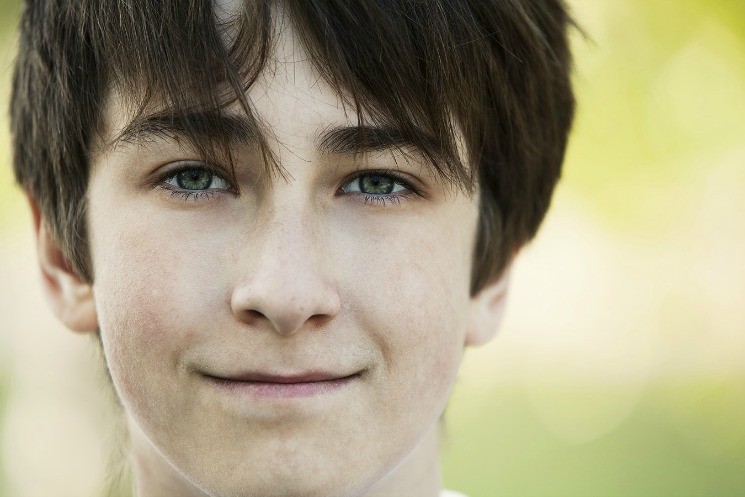 teenage male smiling