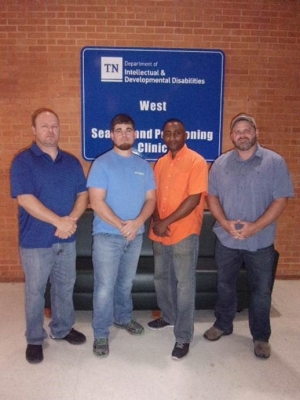 Portrait Image of West Therapeutic Equipment Workers in front of wall