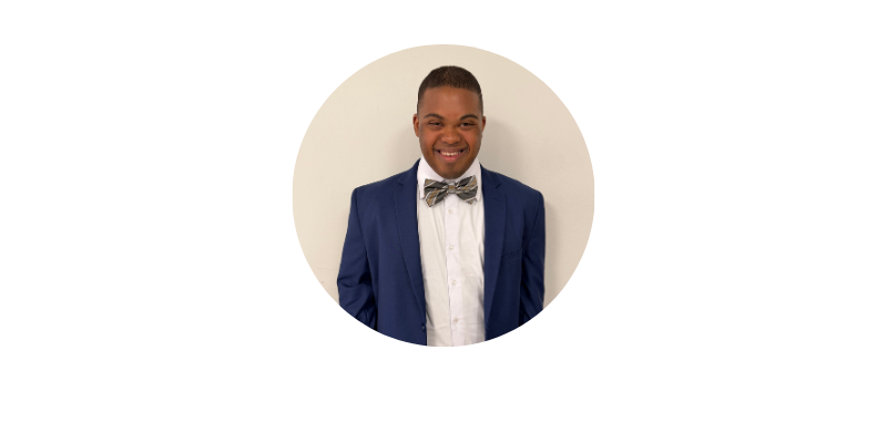 image of young man, Victor Madden, smiling in a suit