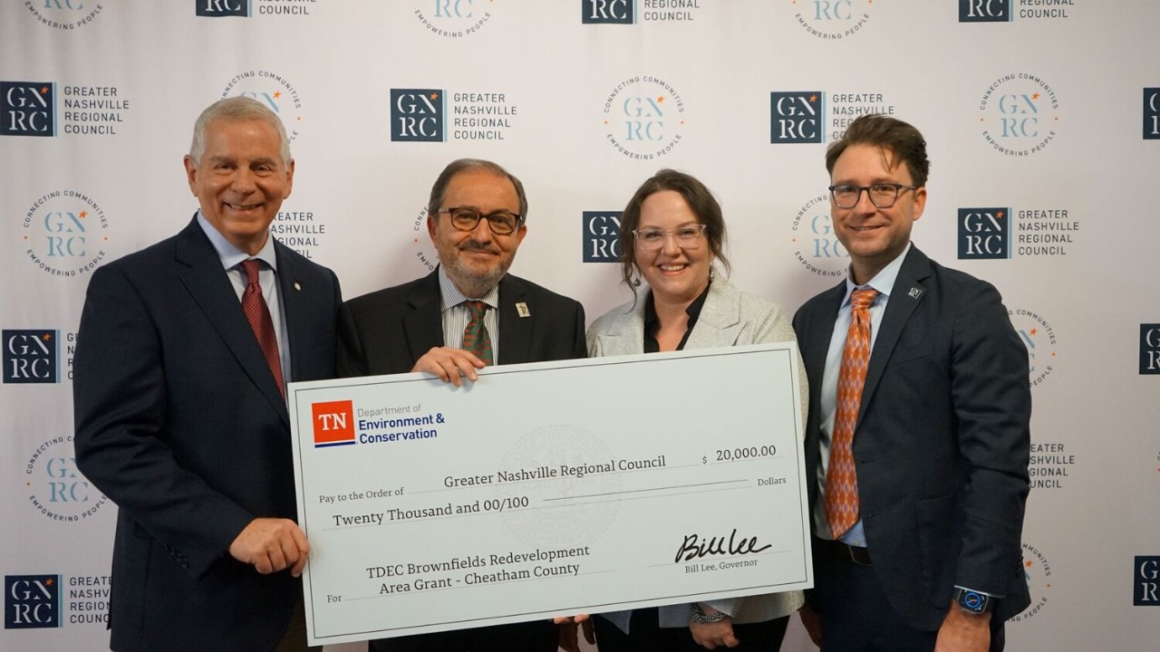 The Tennessee Department of Environment and Conservation (TDEC) presents a check for $20,000 to Cheatham County for its plans in brownfield redevelopment. From left are Joe Pitts, mayor of Clarksville and chair of the Greater Nashville Regional Council; Kerry McCarver, mayor of Cheatham County; Tara Pedraza, TDEC director of Stakeholder Engagement; and Michael Skipper, executive director of the Greater Nashville Regional Council.