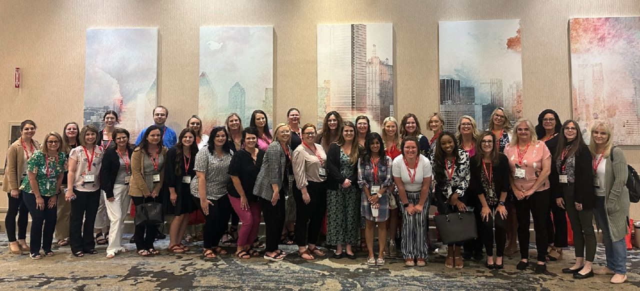 conference members pose for picture