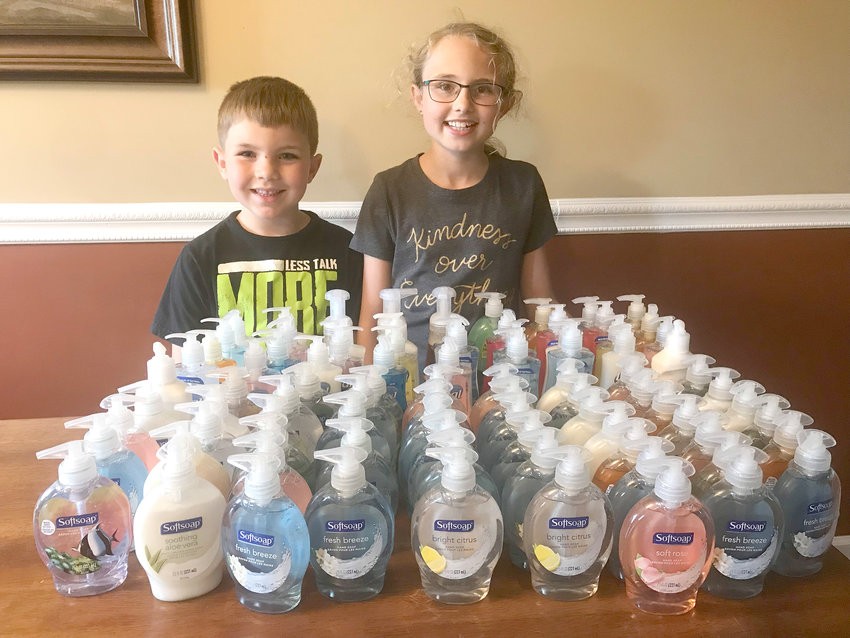 Lillie and Olen collect soaps for Hope Clinic