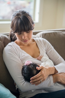 Mother breastfeeding infant