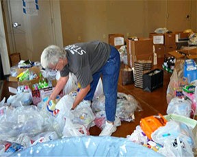 Memphis, TN, May 10, 2011 -- Volunteer Kay Norris of Shelby Cares volunteer organization, sets up bags of essential items for victims of the Mississippi River flooding. The Shelter at Hope Presbyterian is one of the largest in Memphis. Marilee Caliendo/FEMA 