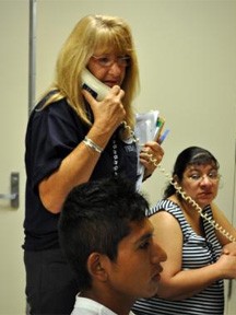 Memphis, TN, May 13, 2011 -- DRC Manager Bea Riddle, assists applicants calling to register using the Disaster Recovery Center Phone Bank. The DRC opened this morning at the Hope Presbyterian Shelter on Walnut Grove Road, Memphis. Marilee Caliendo/FEMA 