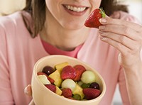 Breakfast-choices-lady_holding_bowl_of_fruit_200